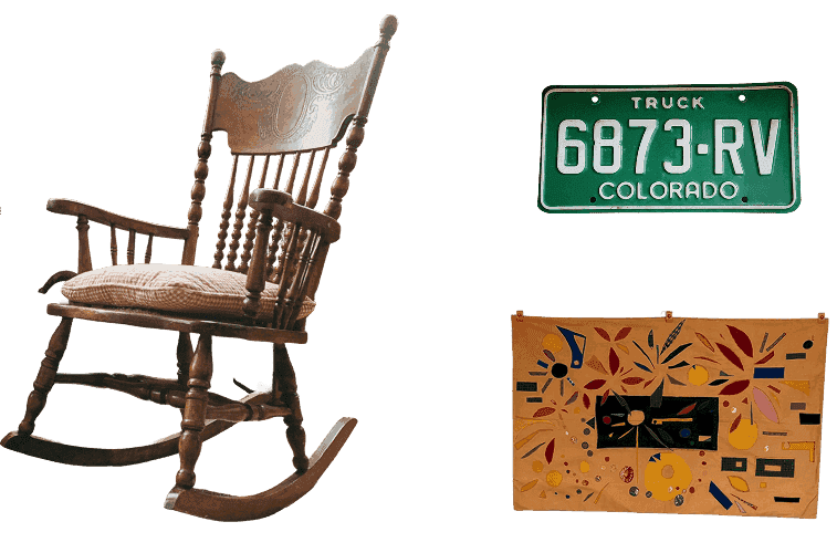 Office ephemera: a wooden rocking chair and vintage Colorado license plates
