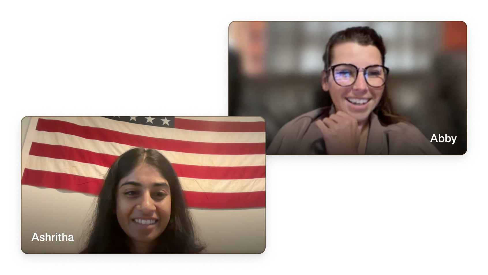 Ambrook team members Ashritha and Abby on a live video support call, with an American flag visible in the background