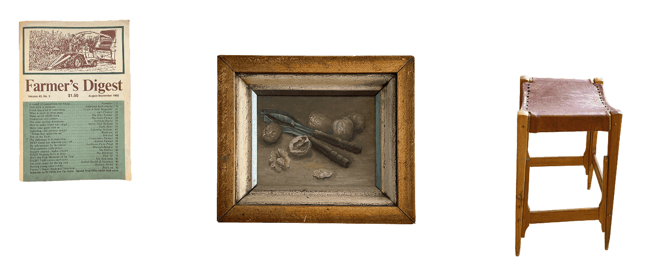 Office ephemera: a Farmer's Digest magazine, a framed still-life, and a leather-top stool