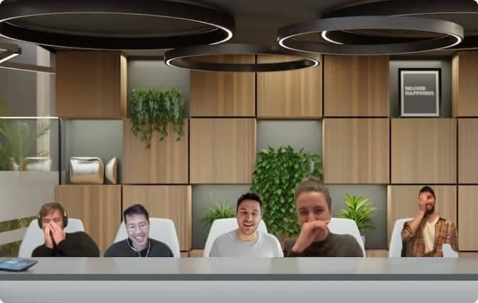 The Ambrook team laughing while using a zoom background that mimics a conference room