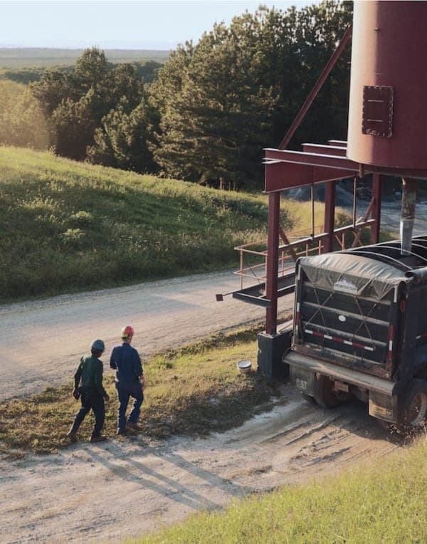 Trucking partners preparing to move product from a rural business