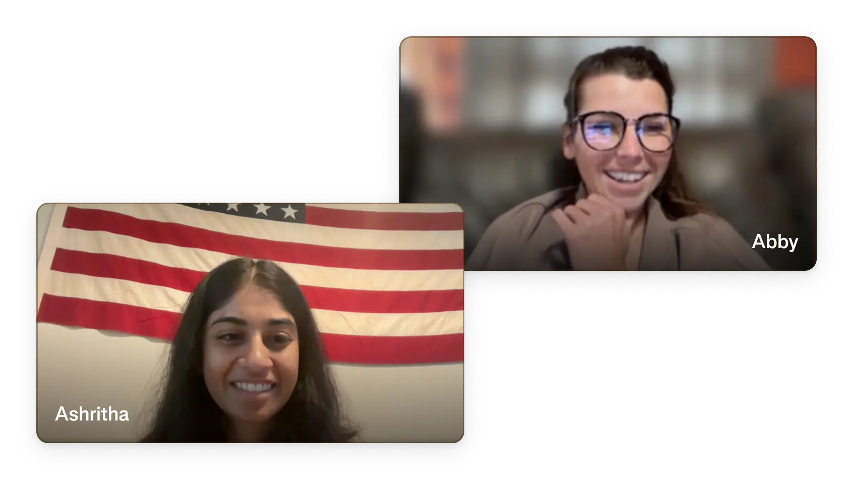 Ambrook team members Ashritha and Abby on a live video support call, with an American flag visible in the background